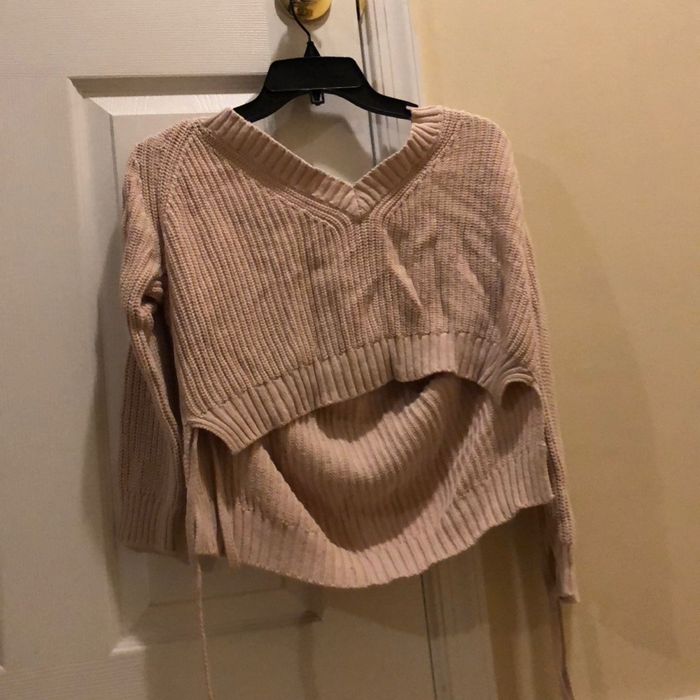 A pink sweater